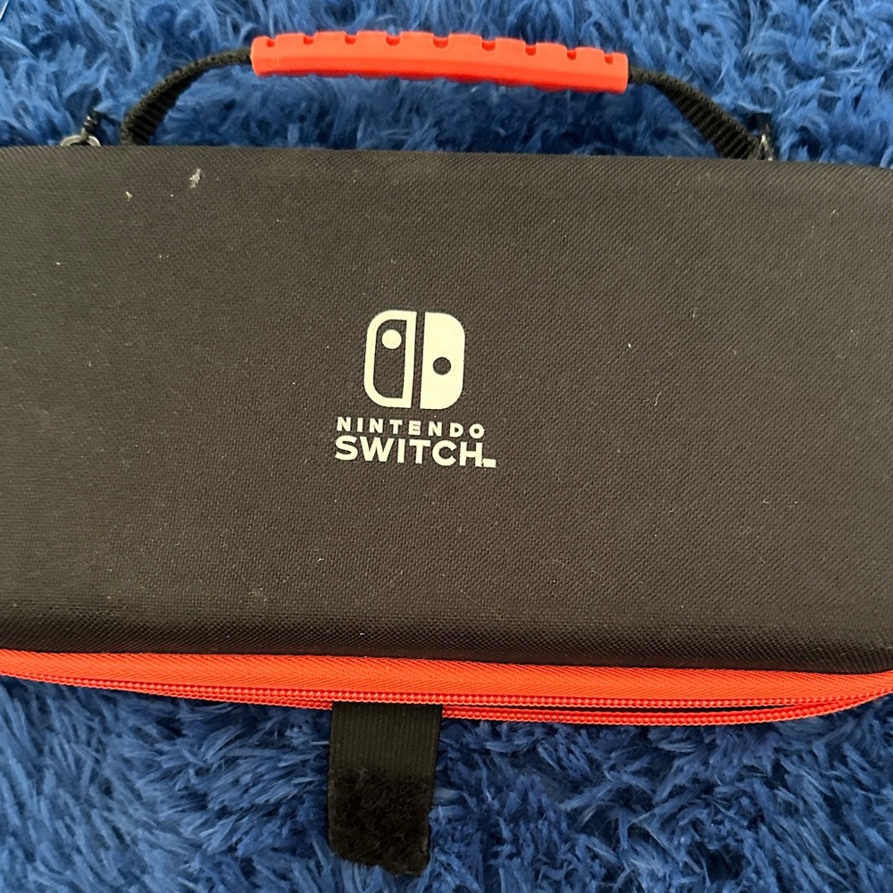 Nintendo Handheld Console with Blue and Red Controllers